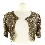 A 1930s gold sequinned on black net evening cape, another in black and another in white (3) Gold
