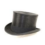 A black silk top hat , Label states 7/4, 59L