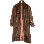 A modern black Fox and woven rabbit fur gilet and vintage brown rabbit fur jacket and Musquash coat