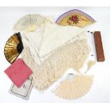 A 1920s cream silk embroidered shawl with deep fringe 144cm x 150cm a collection of 4 fans in