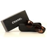 Brown Chanel sunglasses with diamanté sunburst pattern to arms, together with limited edition