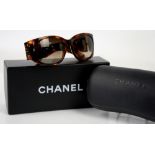 Chanel sunglasses in faux tortoiseshell and diamanté with multiple crossed “CC’s” together with box,