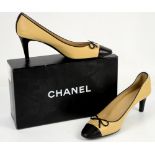 Chanel shoes in classic beige with black leather toe caps with bow and logo, size 38.5 with box,