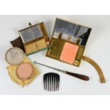 A Minaudiere Compact in gilt metal, with comb lipstick holder, mirror and cigarette case, marked