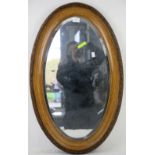 20th century oval giltwood mirror with carved border. 80H x 52W