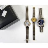 Two Dunhill watches; a gentleman's stainless steel watch with white face and ladies watch with