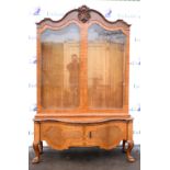 20th century walnut glazed display cabinet with carved scrolled cornice above two shaped bevelled