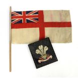 The National flag of Wales x 2 180cm x 87cm and 120cm x 66cm an embroidered Prince of Wales crest,