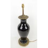 Black table lamp with brass mount