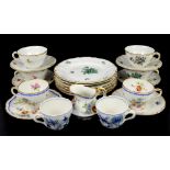 Two Meissen onion pattern cups, Nymphenburg floral decorated teacups, saucers and plates, and