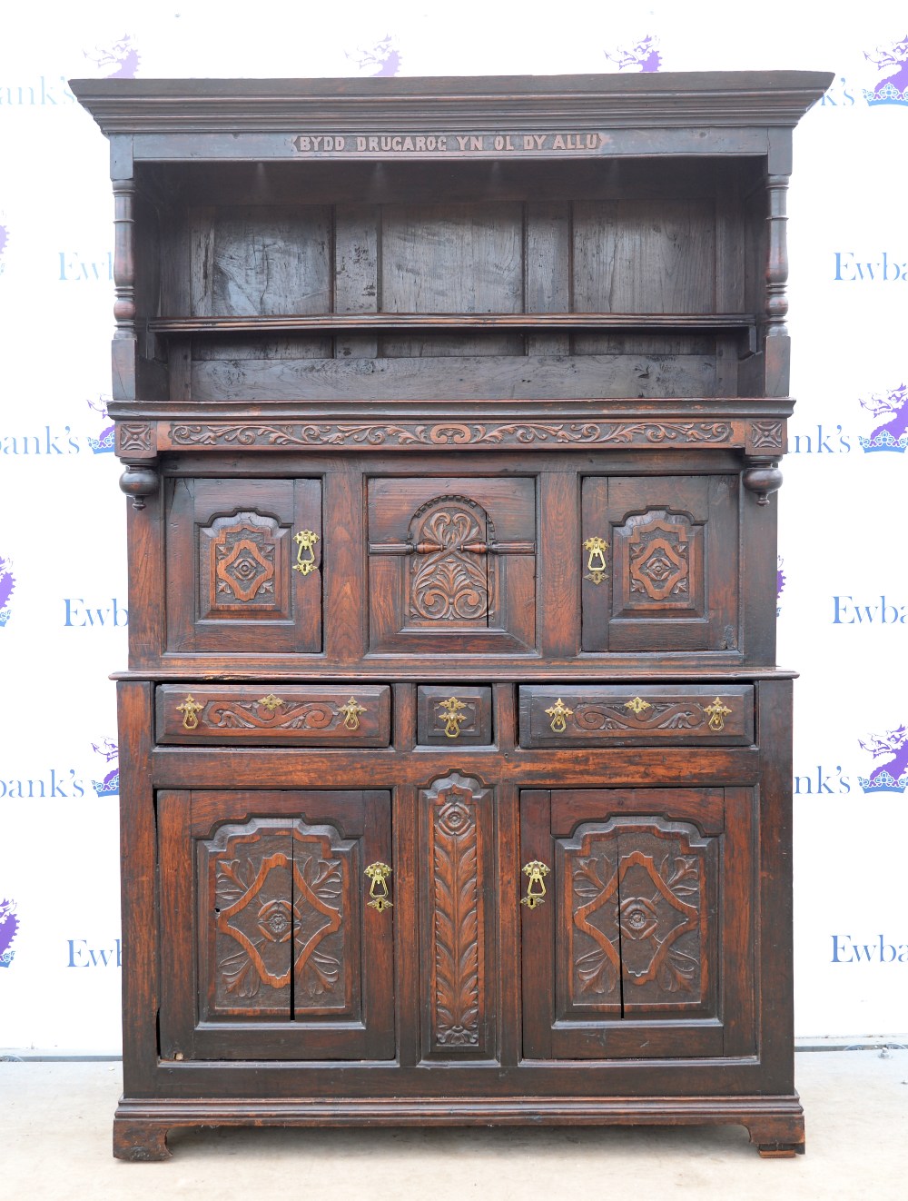 18th century and later Welsh oak tridarn, the moulded cornice above frieze carved 'Bydd Drugarog