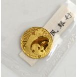 2002 20 yuan 1/20oz .999 gold China panda coin.