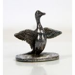 Silver model of a duck exercising its wings, by CS