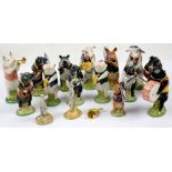 14 Royal Doulton Beswick pig band figurines and two meerkats