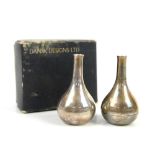 Pair of Dansk Designs Ltd tapered teardrop miniature candlesticks, plated and filled, 6cm high, in