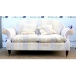 Modern scroll arm settee upholstered in striped velour with mahogany legs on castors by Wesley-