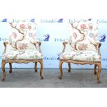 Pair of 19th century oak framed floral upholstered armchairs with scroll armrests raised on cabriole