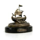 Continental silver 800 grade model of an oar and sail boat, on a wooden plinth