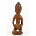 Carved wooden African Yoruba Ibeji twin figure, H.29cm