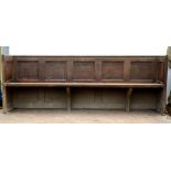 19th century oak church pew with panelled backrests. 85H x 49D