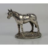 Silver model of a horse by country scene