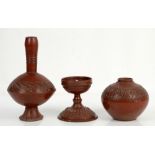 Three Turkish Tophane red pottery vessels, to include footed vase with elongated neck with