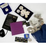 A collection of coins, which includes a UK uncirculated set 2008 Shield of Arms in Royal Mint