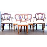 Seat of eight reproduction mahogany dining chairs with shaped backrest on turned legs together