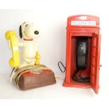 Snoopy BT telephone and another telephone in the form of a red telephone box