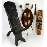 African carved tribal birthing style chair, carved with animals, H72cm, together with a Zulu style