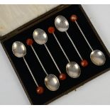 Cased set of silver spoons each with a facet cut amber coloured stone, by S Ltd B'ham 1902