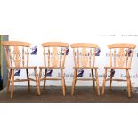 Set of four modern pine kitchen chairs on square tapered supports.