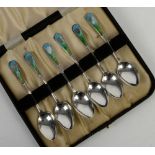 Cased set of six silver and enamel spoons by AJ Bailey, Birmingham 1910