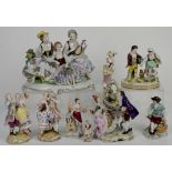 Quantity of Continental porcelain figural groups of courting couples and others, ornately
