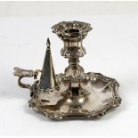 George IV silver chamberstick with floral scrolled decoration, with detachable sconce and snuffer,