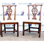 Pair of 19th century mahogany Chippendale style dining chairs on square tapered supports.