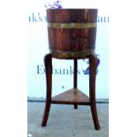 19th century mahogany brass bound barrel planter on tripod supports. 70H