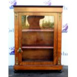 Early 20th century walnut pier cabinet with marquetry inlaid decoration and a glazed door to