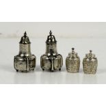 Pair of Arts & Crafts silver pepperettes B'ham 1910 and a smaller pair of Victorian silver