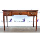 20th century mahogany bow fronted writing desk with leather top above two short and one long drawers