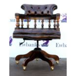 Reproduction leather and mahogany swivel Captains chair with buttoned seat and backSold on behalf of