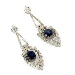 Art Deco drop earrings, set with two oval cut sapphires, in articulated setting, estimated total