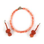 Mixture of mainly coral items, including a bracelet, a pair of carved coral earrings, loose coral
