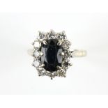 Sapphire and diamond cluster ring, central oval cut sapphire, estimated weight 2.30 carats,