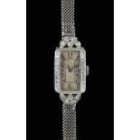 Art Deco watch, rectangular dial with Roman numerals and minute track, with a swiss cut diamond