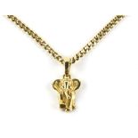Gold elephant pendant, with articulated bail, 3.2 x 1.8cm, stamped 18 ct and a flat curb link chain,