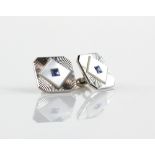 Art Deco style cufflinks, centrally set with square cut sapphires in a mother of pearl border,