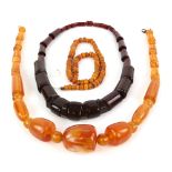 Strung copal beads, 50cm in length, largest bead diameter 10.5mm, with other loose copal beads,