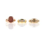 Three antique rings, including a three stone sapphire and diamond ring, mount testing as 18 ct, a