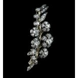 Victorian diamond floral brooch, set with old mine cut diamonds, designed as five diamond flowers